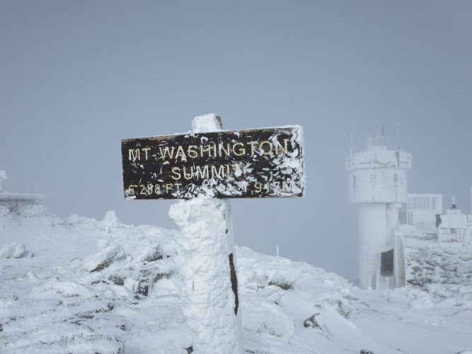 snowy summit sign