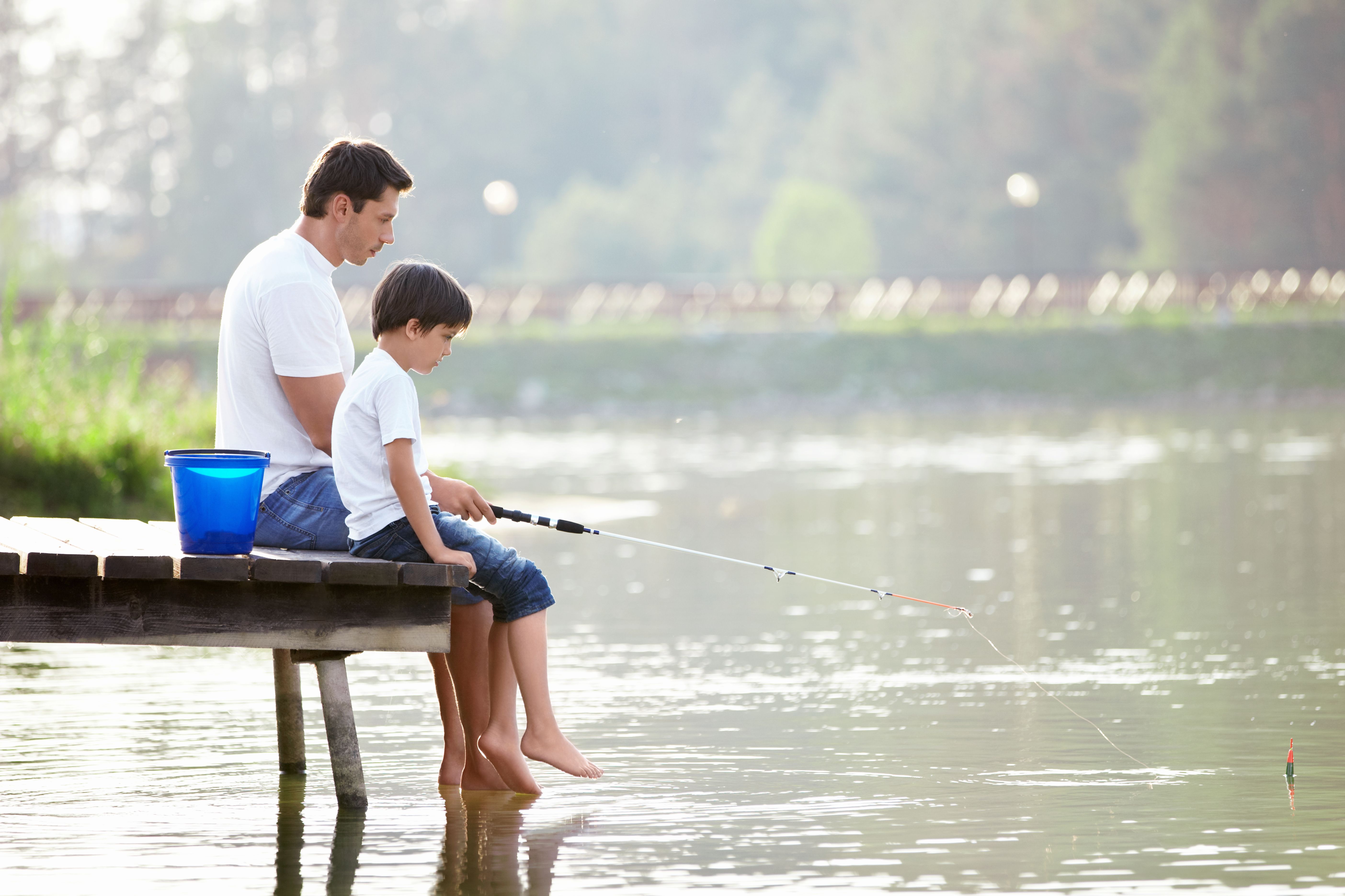 father and son fishing. Parents are PMA members to protect their children