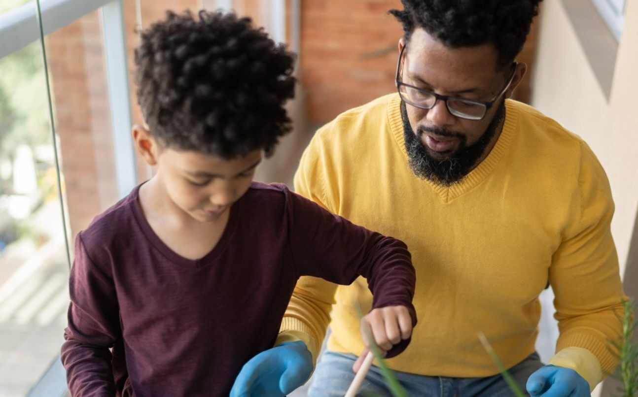 Dad gardening with his son