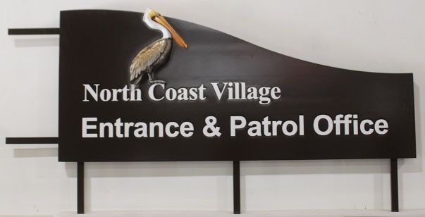 L21620 – Carved and Sandblasted 2.5-D HDU Entrance Sign for "North Coast Village Entrance & Patrol Office" with Pelican