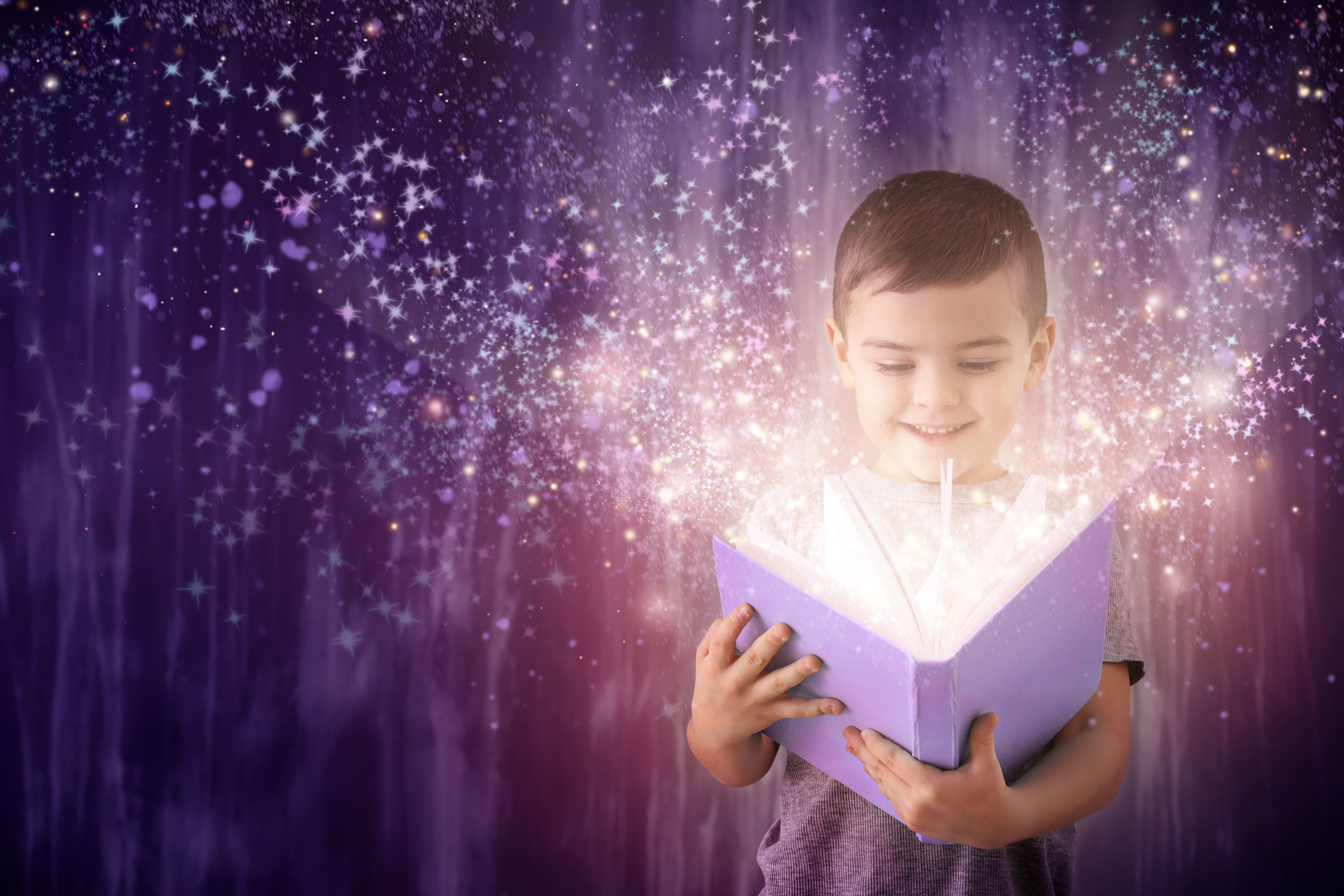 Smiling child opens a glowing purple book, symbolizing the magic of learning supported by March Mini Grants