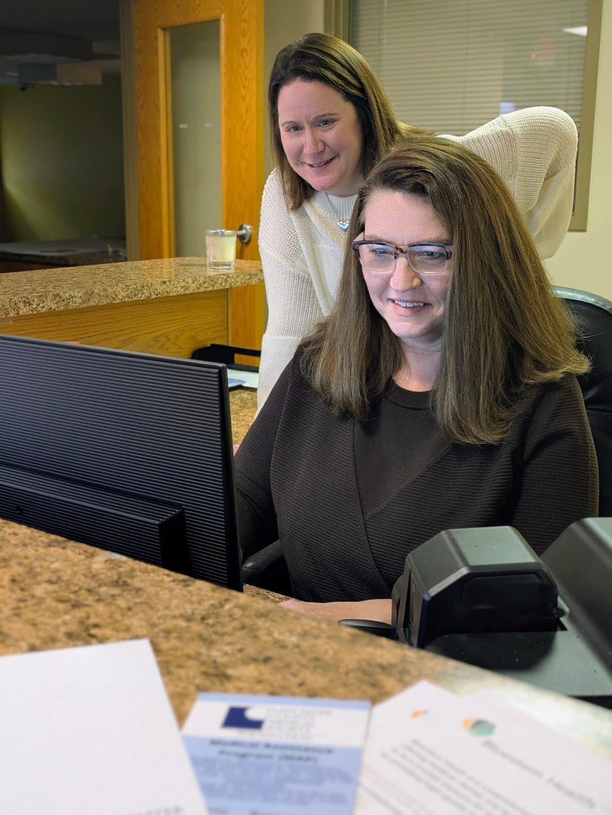 Lancaster County Medical Society (LCMS) Executive Administrative Assistant Bonnie Horne (front) with LCMS Executive Director Kelly Braswell-Burbach (back) at the LCMS front desk