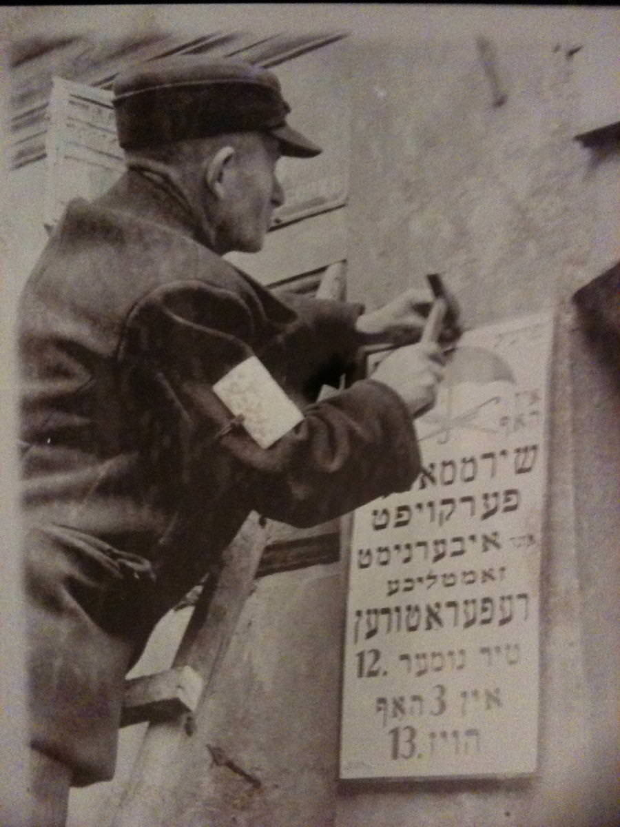 Installing plaque in the Krakow Ghetto