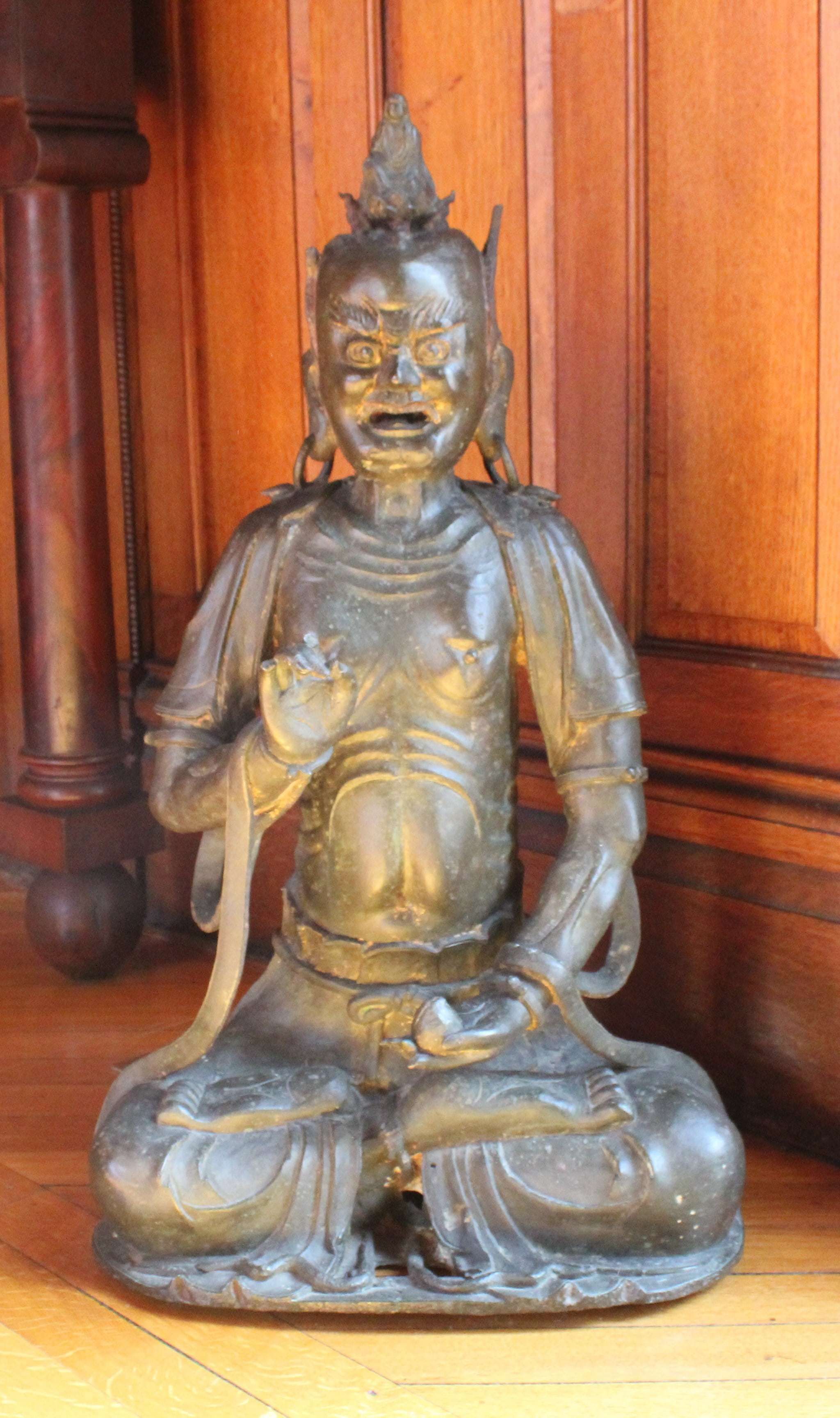 Image of bronze statue on display in the billiard room of the Davis Mansion
