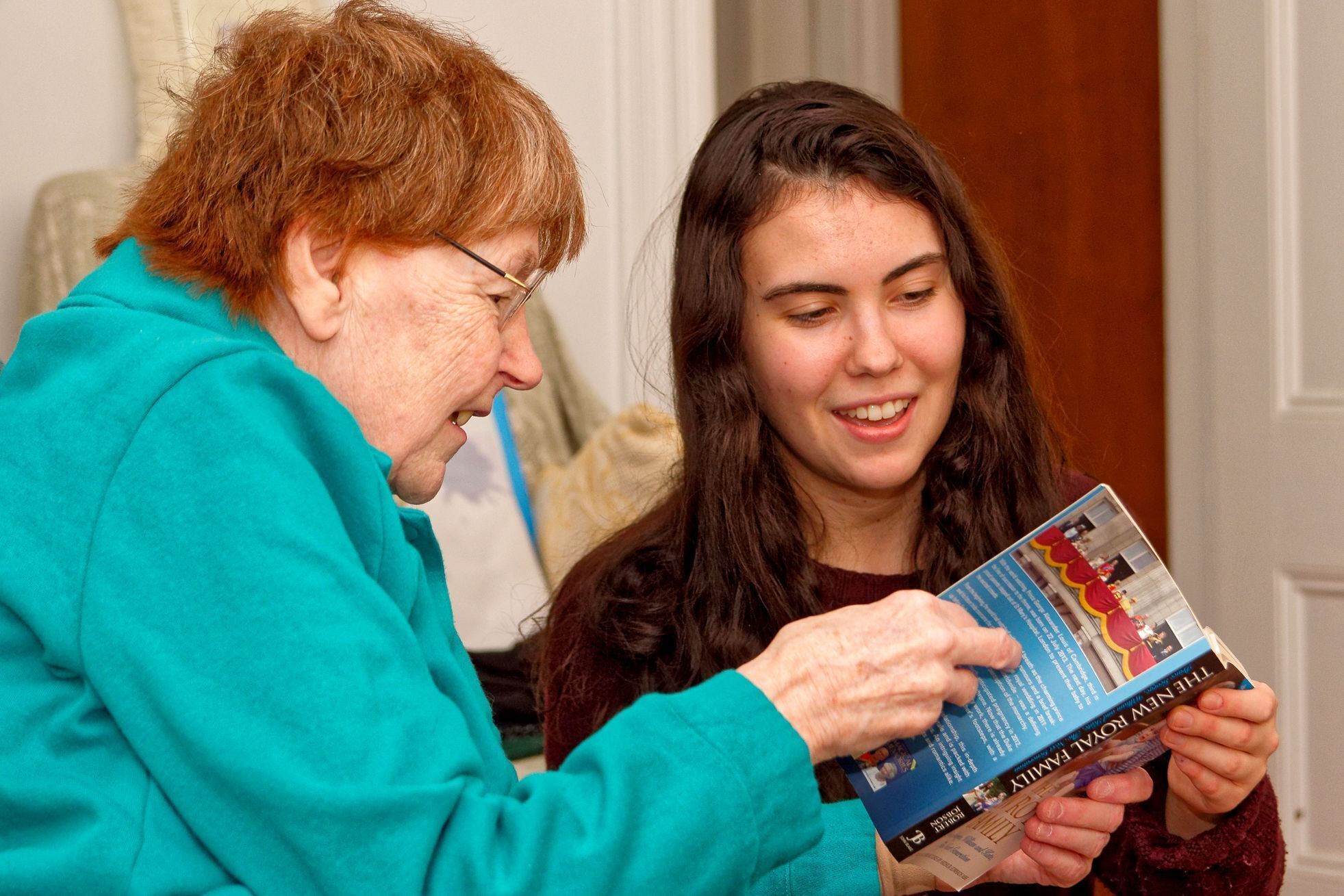 Nancy sharing a book with her Friendly Visiting Volunteer