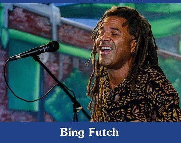 This head shot has musician Bing Futch is singing into a microphone.