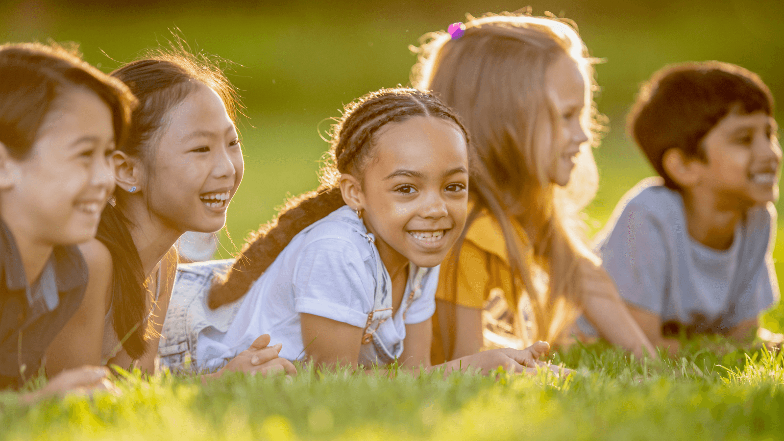 Kids outside in grass