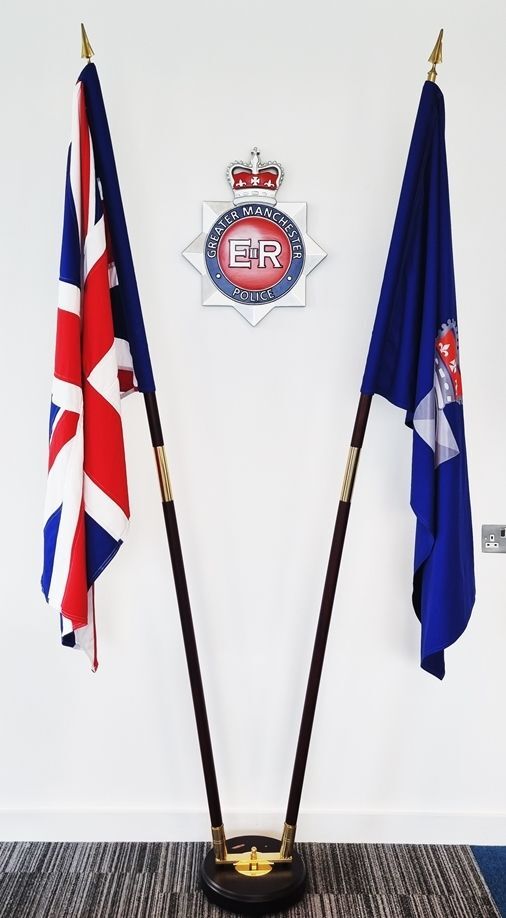 EP-1023 - Emblem for the Greater Manchester Police Between Flags, UK