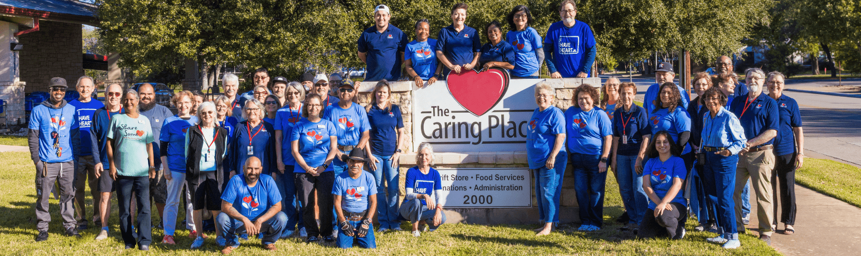 Caring Place volunteers and team in front of The Caring Place headquarters.