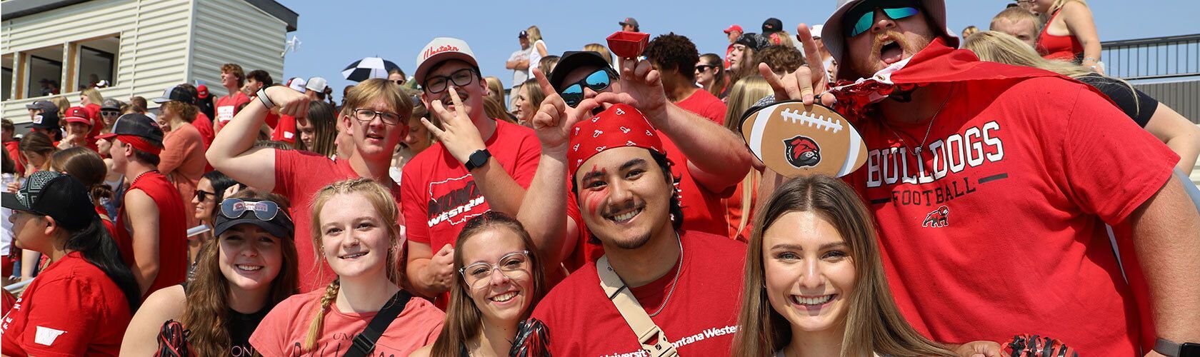 Group of alumni standing outside talking