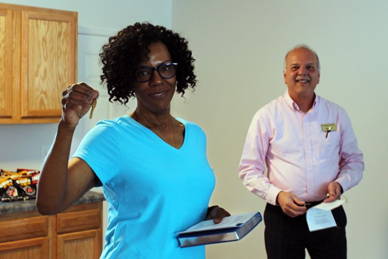 Gail Holds Keys to Her new Dayton Habitat Home.