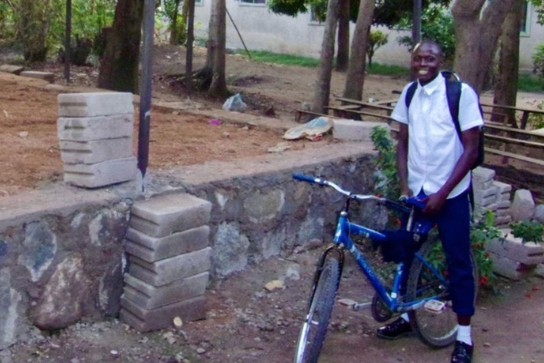 Student riding bike.