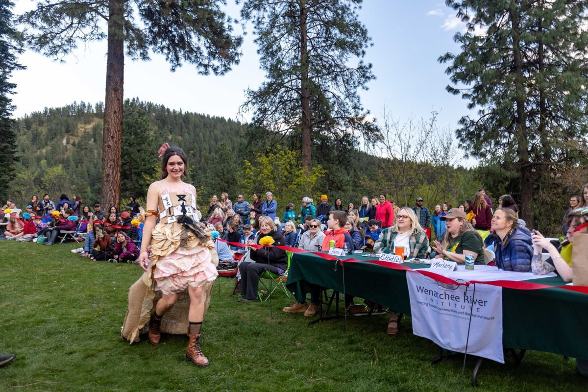A photo of a participant strutting the runway in front of judges wearing her Coffee Couture outfit.