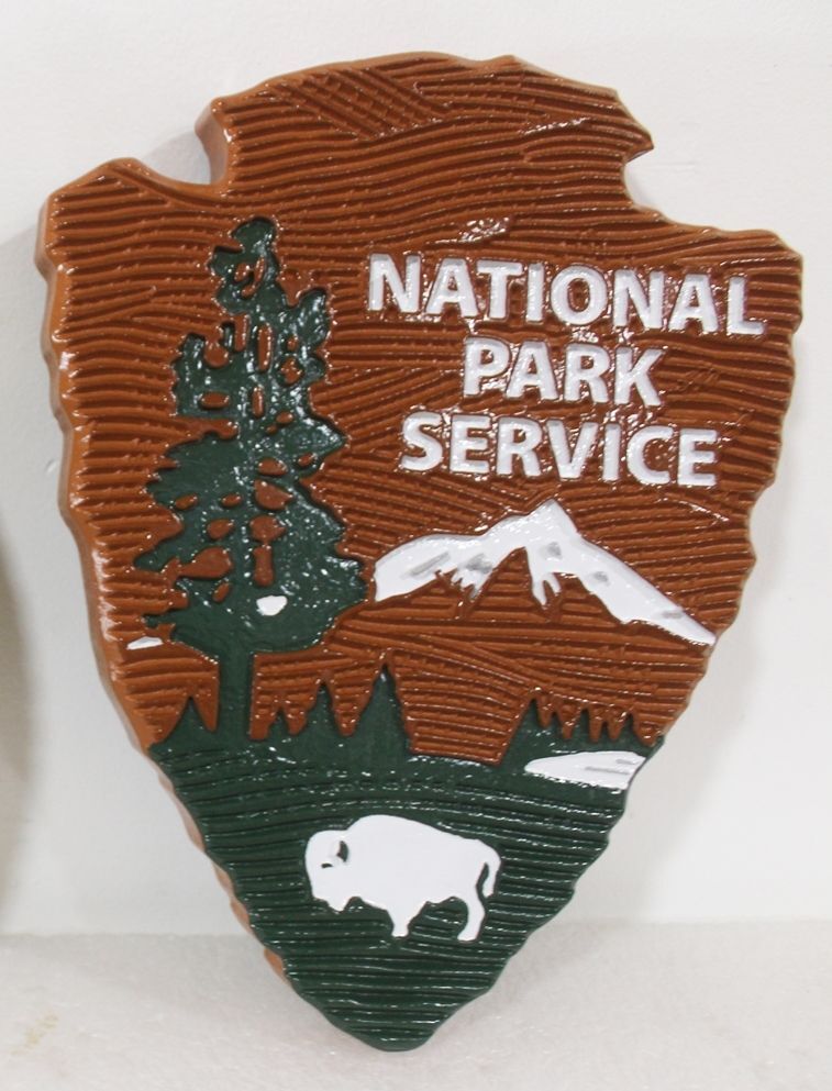 AP-5650 - Carved HDU Plaque of the Logo of the US National Park Service,"Arrowhead" . with Carved Wood Grain Background