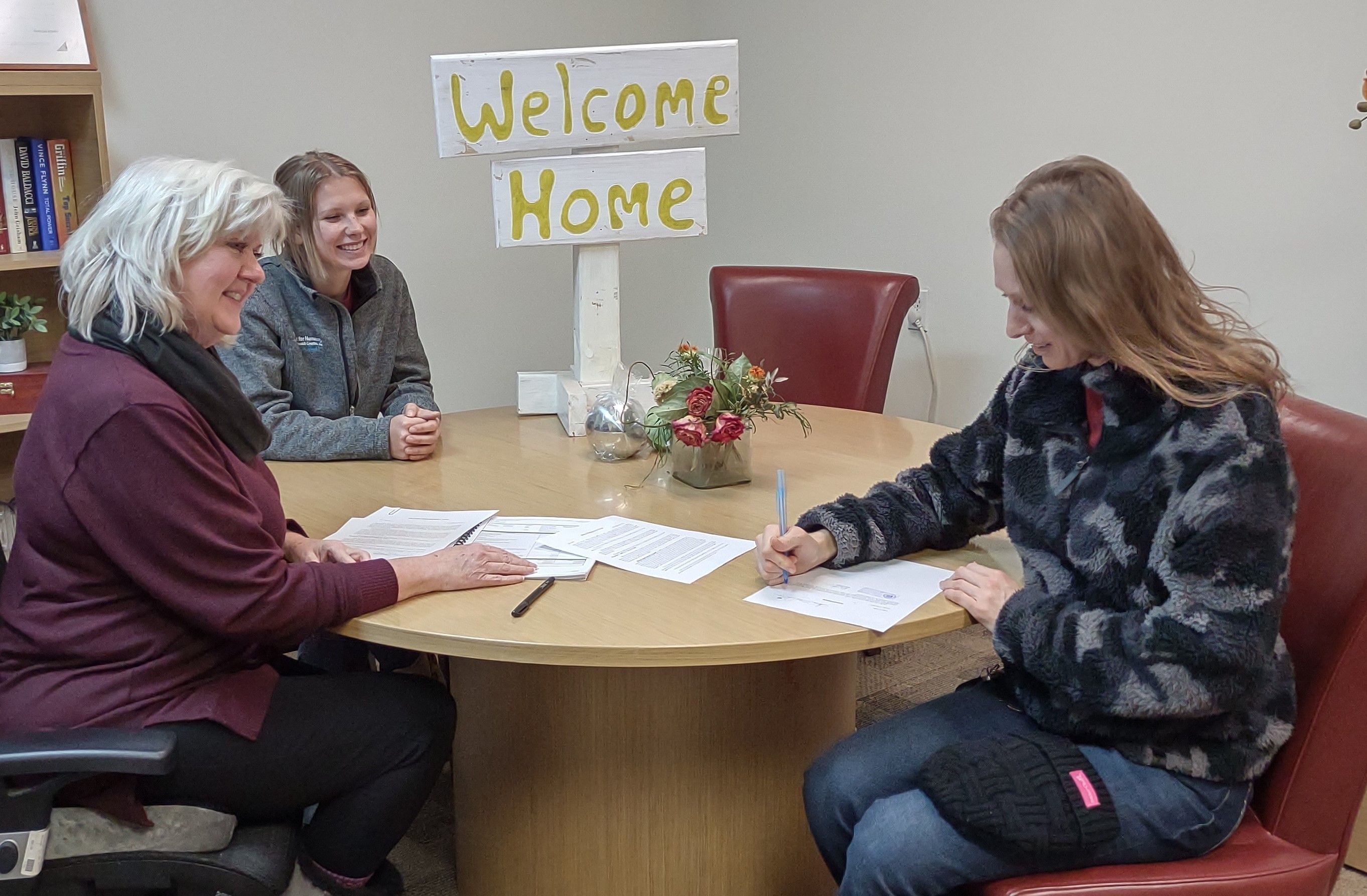 Homeowner signs mortgage papers