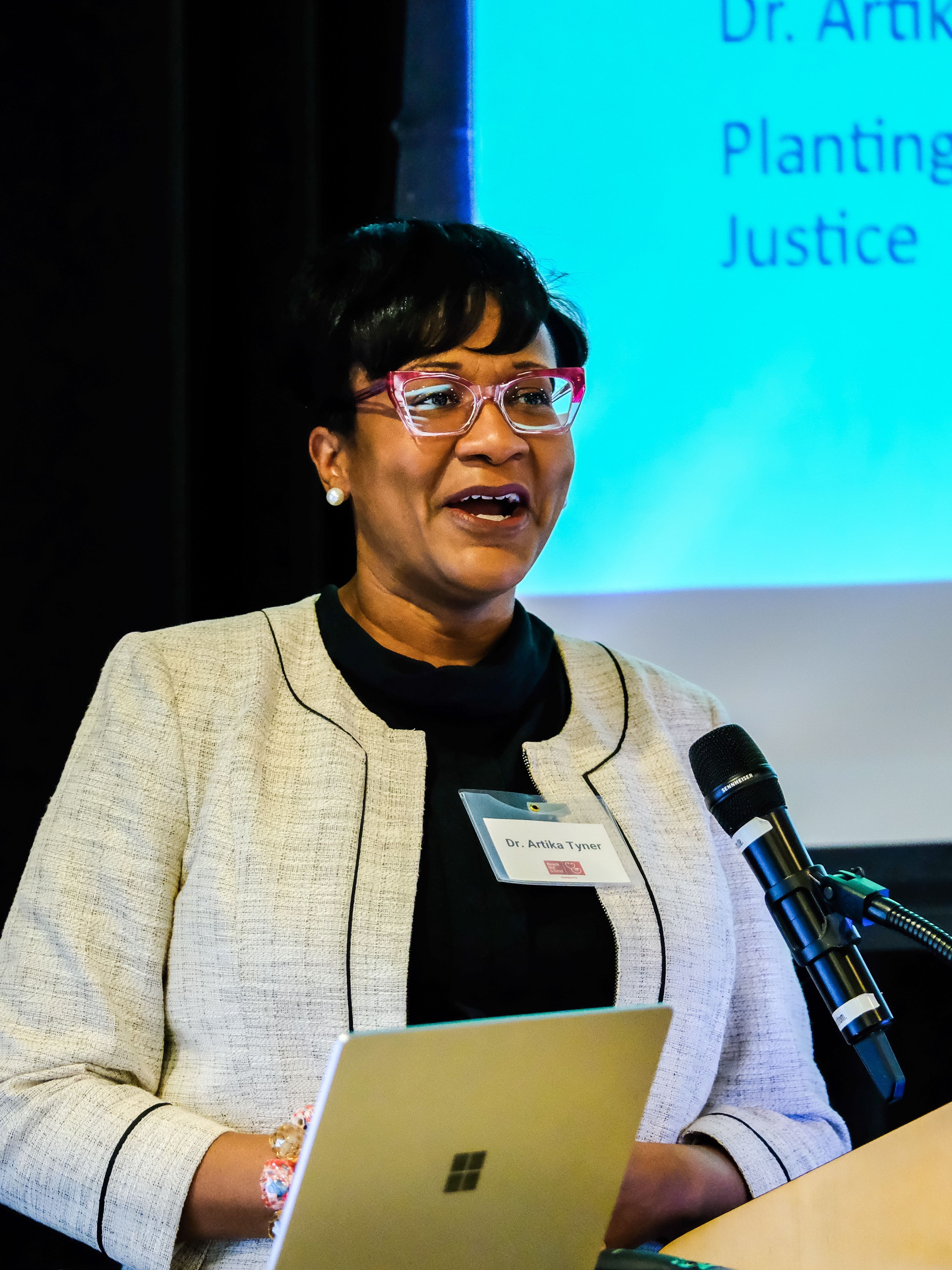 Woman speaks at podium