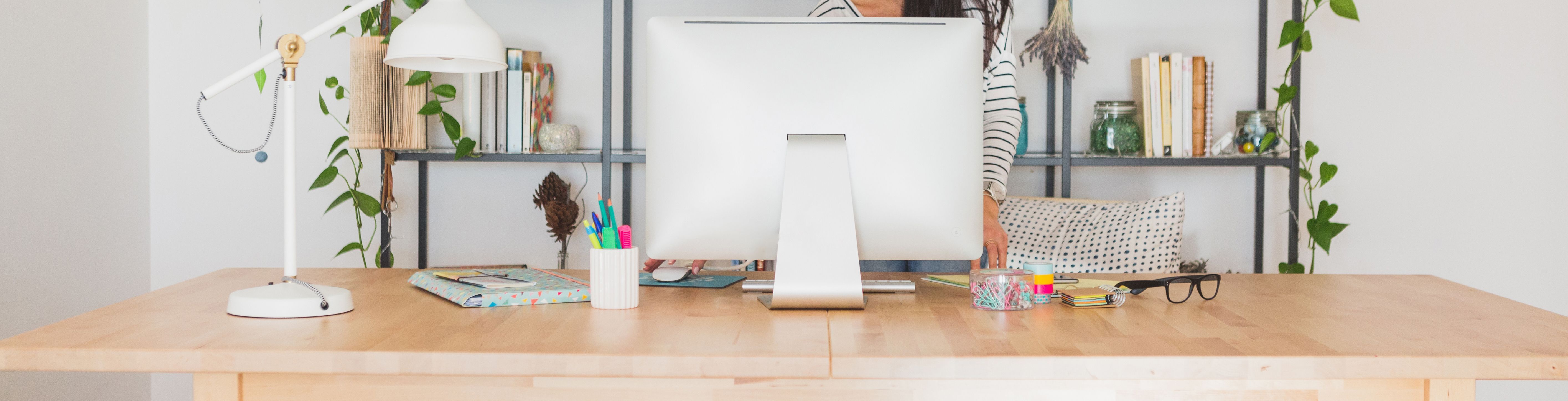 Woman working at clean and organized desk