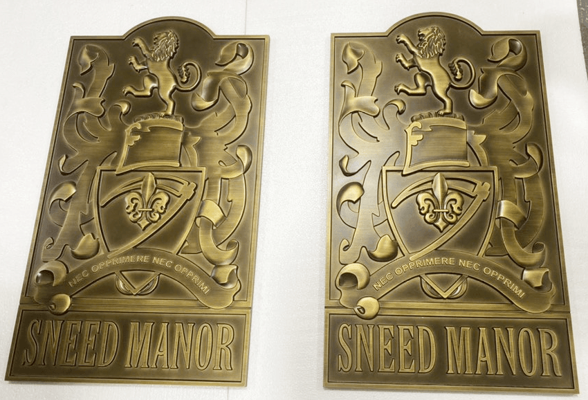 M7724 - Two  3-D Bas-relief Cast Bronze  Plaques of the Coat-of-Arms of Sneed Manor