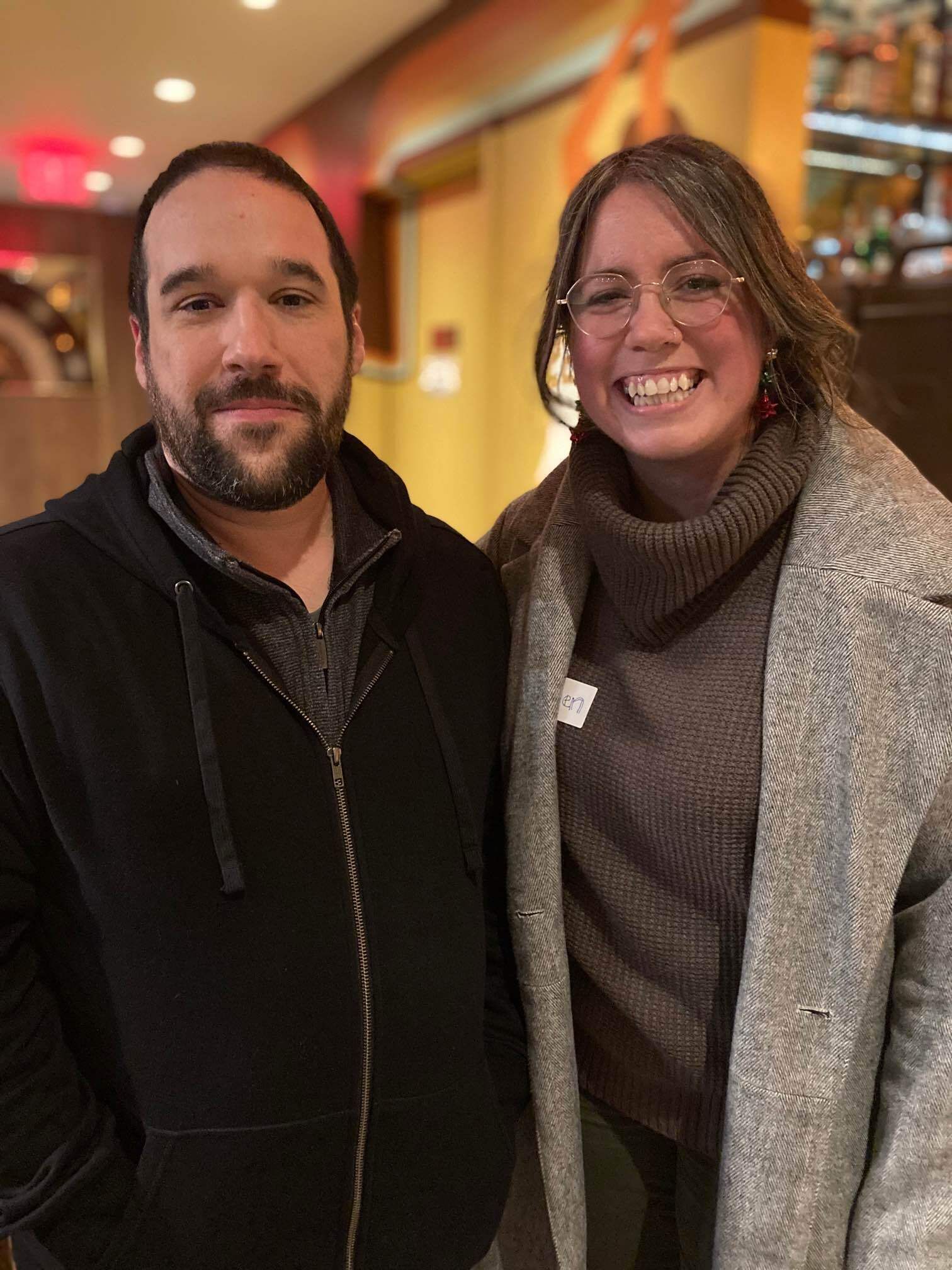 Man and woman posing for photo