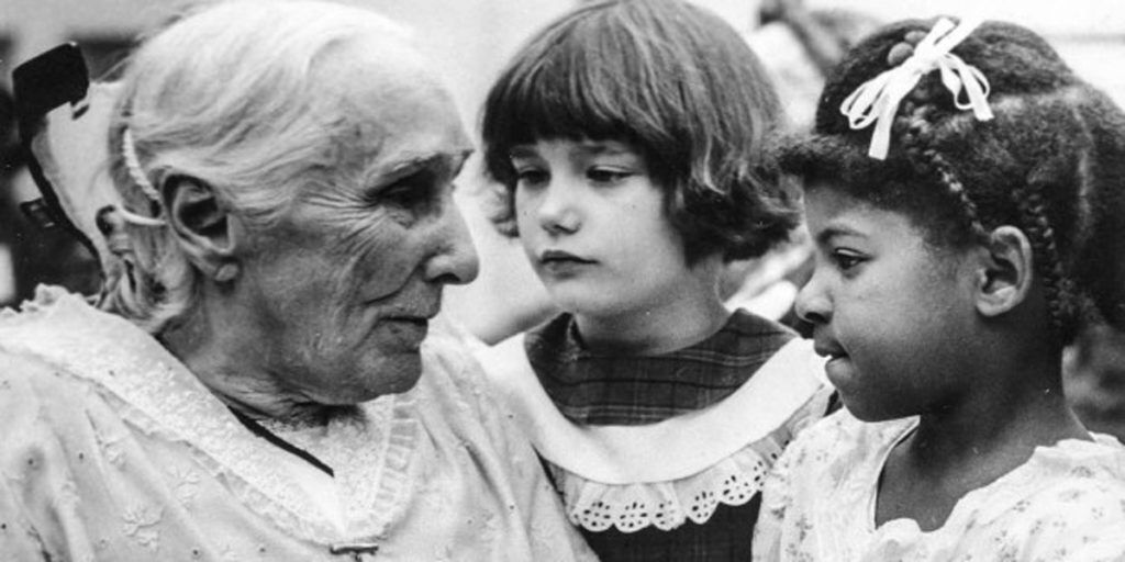 Historical photo of Christ Child Society founder Mary Virginia Merrick working with children
