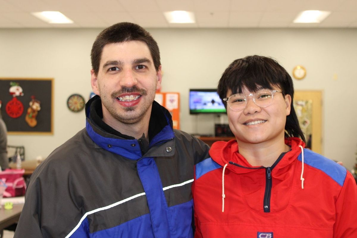 person served and staff smiling