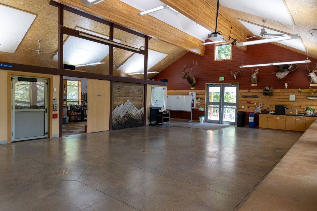 The inside of the Red Barn featuring an open space, counters, and taxidermy.