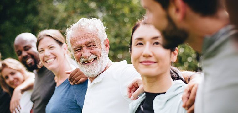 Group of people smiling outside