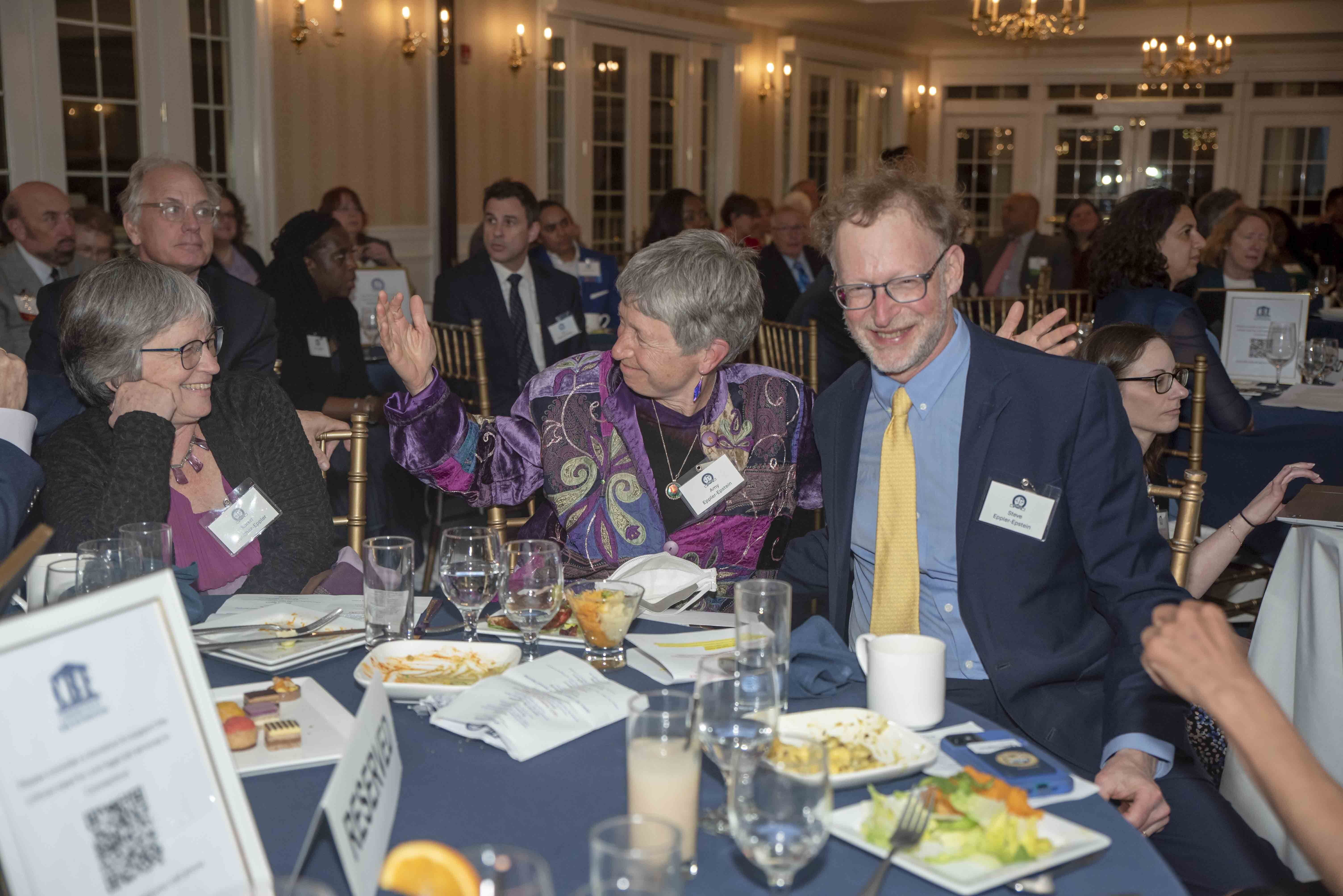 Amy Eppler-Epstein with Steve Eppler-Epstein at dinner table.