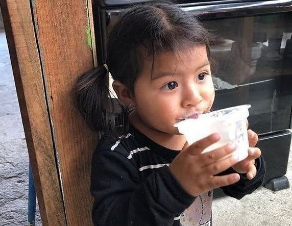 Toddler drinking water.