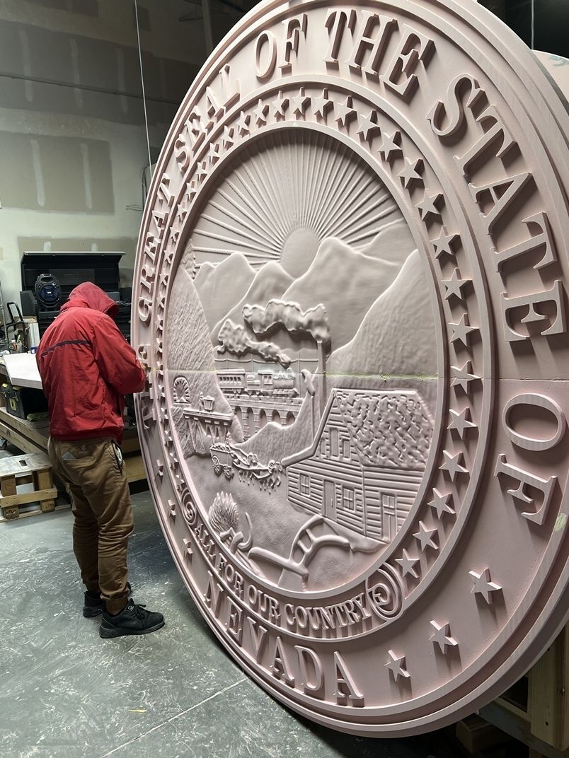 TA1033- 10 ft diameter HDU  aluminum-plated wall plaque e of Nevada's  Great Seal, after carving and fine sanding  before surface finishing