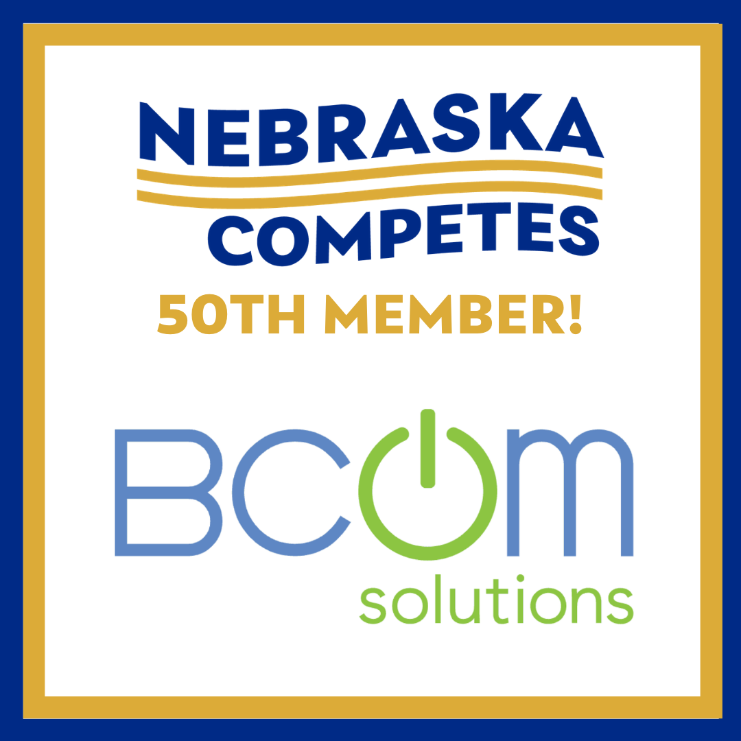 Graphic with Nebraska Competes logo. Text reads: Nebraska Competes 50th member! BCom Solutions