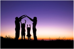 picture of two adults making a bridge with their hands over two children