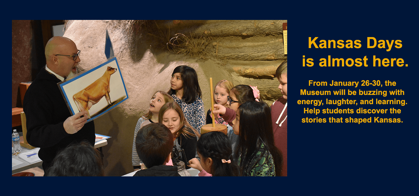 Demolnstrator talking to children about cattle and butter making.