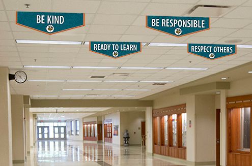 School banners with positive messages in hallway, custom banners for character values