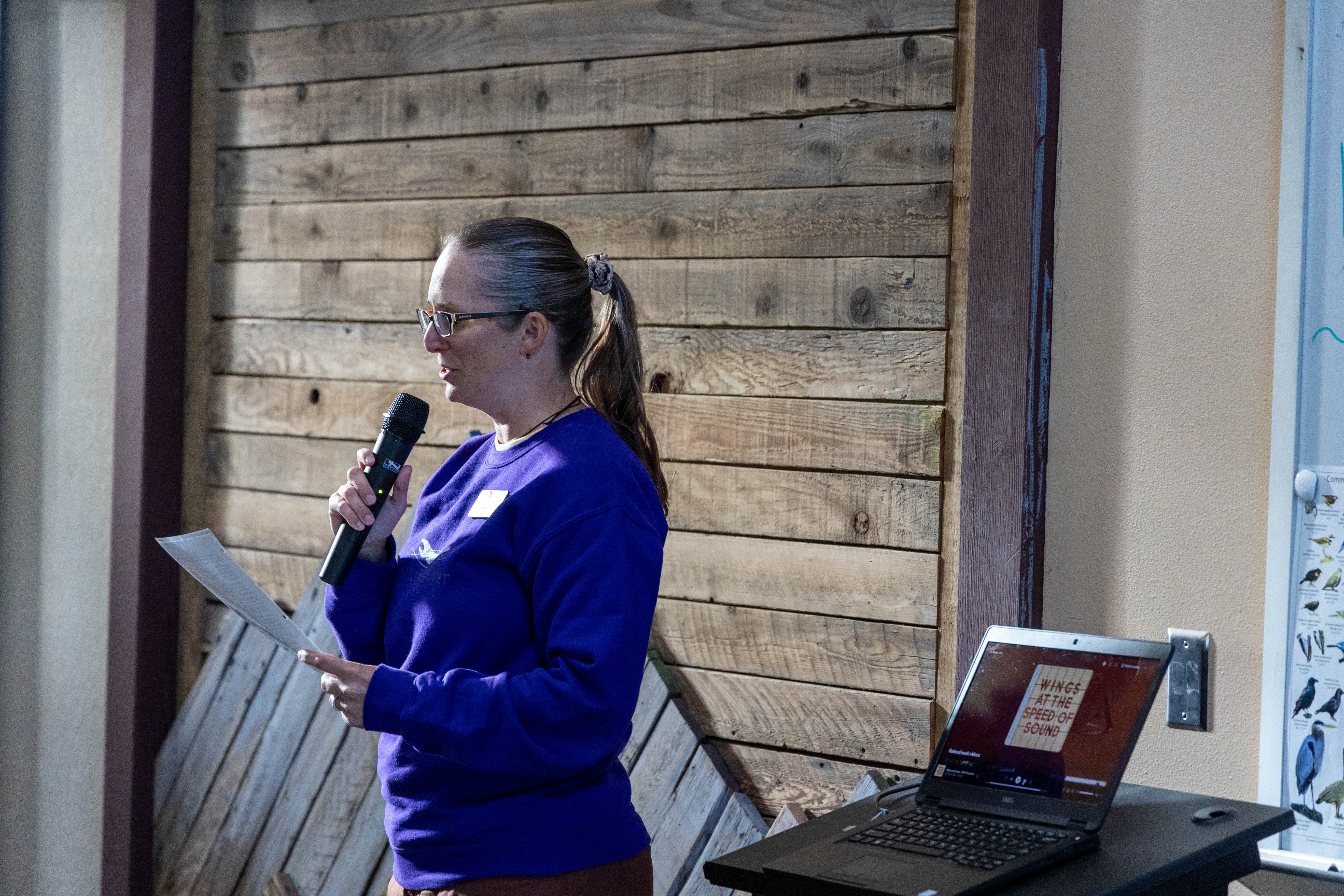 Virginia Shoup reading the Land Acknowledgement.