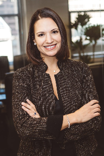 Board Member Leah Sciabarrasi smiles at the camera