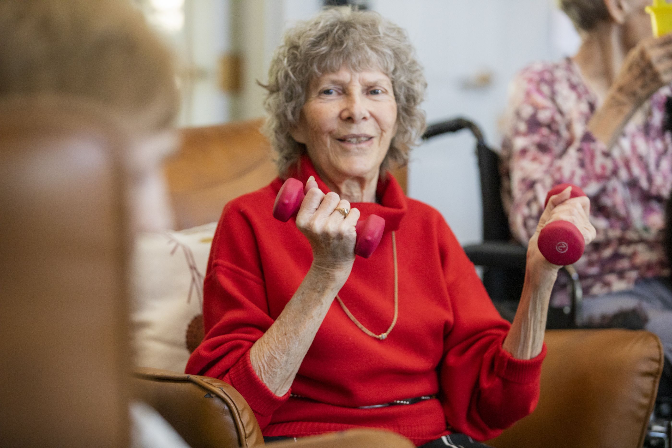 A resident at The Haven participates in chair exercise.