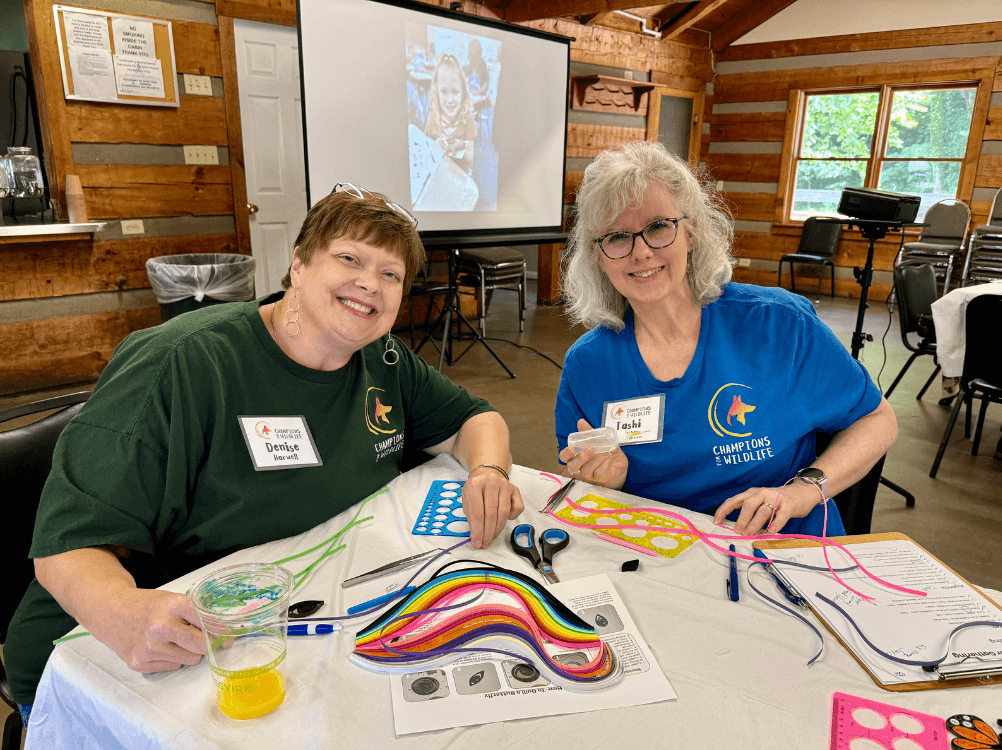 Happy volunteers learn the art of quilling
