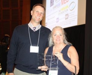 Mark Dunning and Moira Shea are shown presenting the award in honor of Barney Skladany, Jr. (Barney not pictured.)