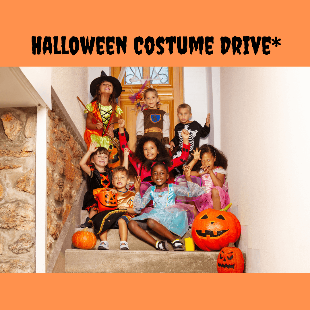 Children's Halloween costumes hanging on a clothes rack.