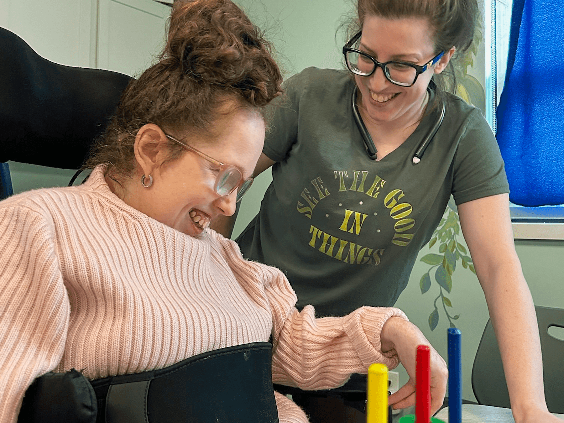 patient smiling with caretaker