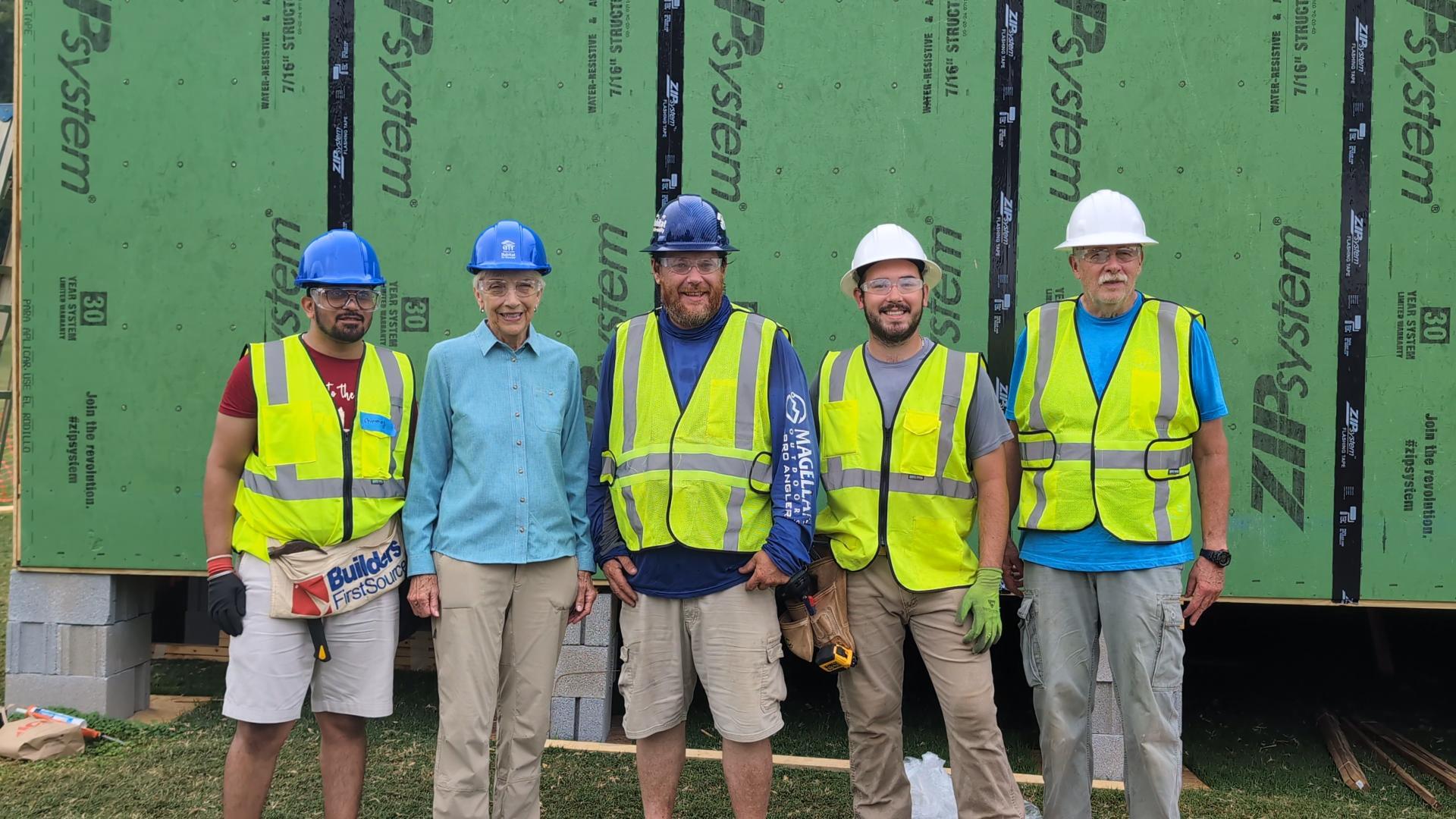 Kevin Parris, Construction Coordinator, poses with a longtime PCHFH donor and HC24 volunteers