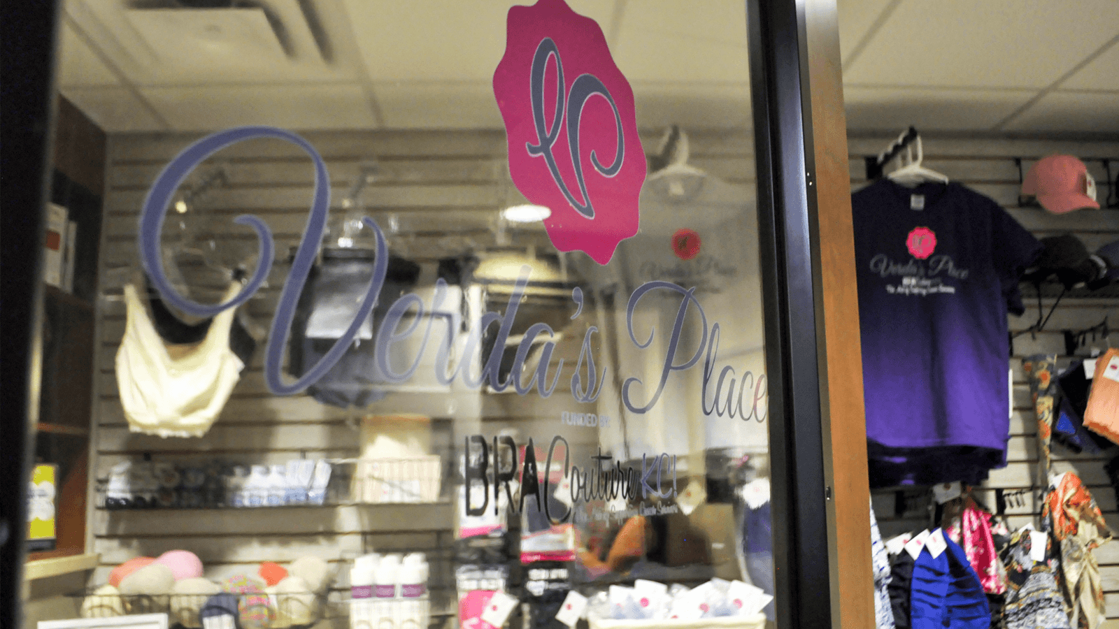 door ajar with shop in the background