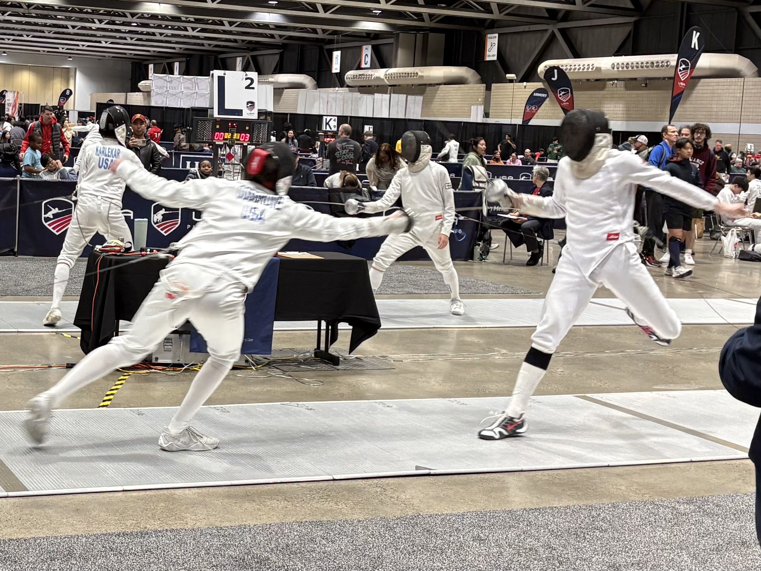 Two youth epee fencers at the Junior Olympics