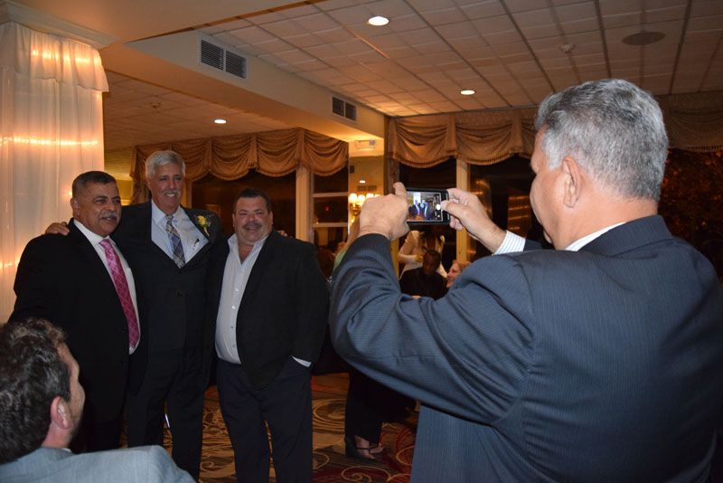 Anthony Perito taking a photo of Luis Alvarez, Greg Goldstein and Joe Perrello