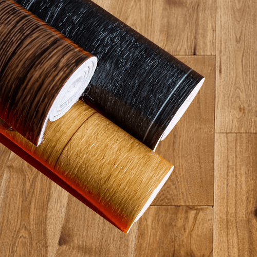 BLACK BROWN AND TAN ROLLS OF PRINTED FLOOR