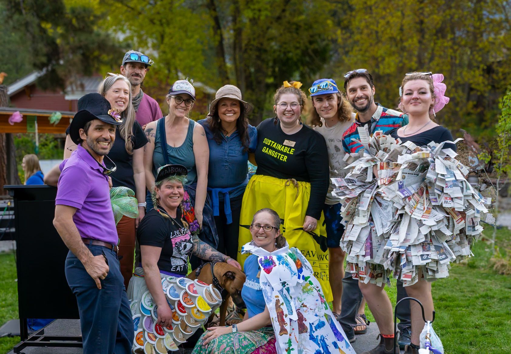 A photo of staff during the 2025 Trashion Show dressed in recycled and upcycled materials.