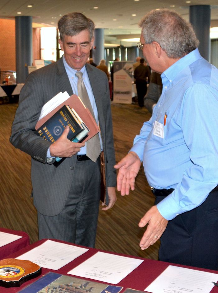 NCMF BoD Chairman Chris Inglis and NCMF Acquisitions Committee Chairman Dave D'Auria at the Silent Auction tables.