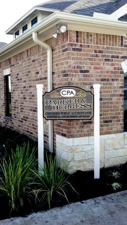 C12005 - CPA Sign Installed with Wood Posts outside Building