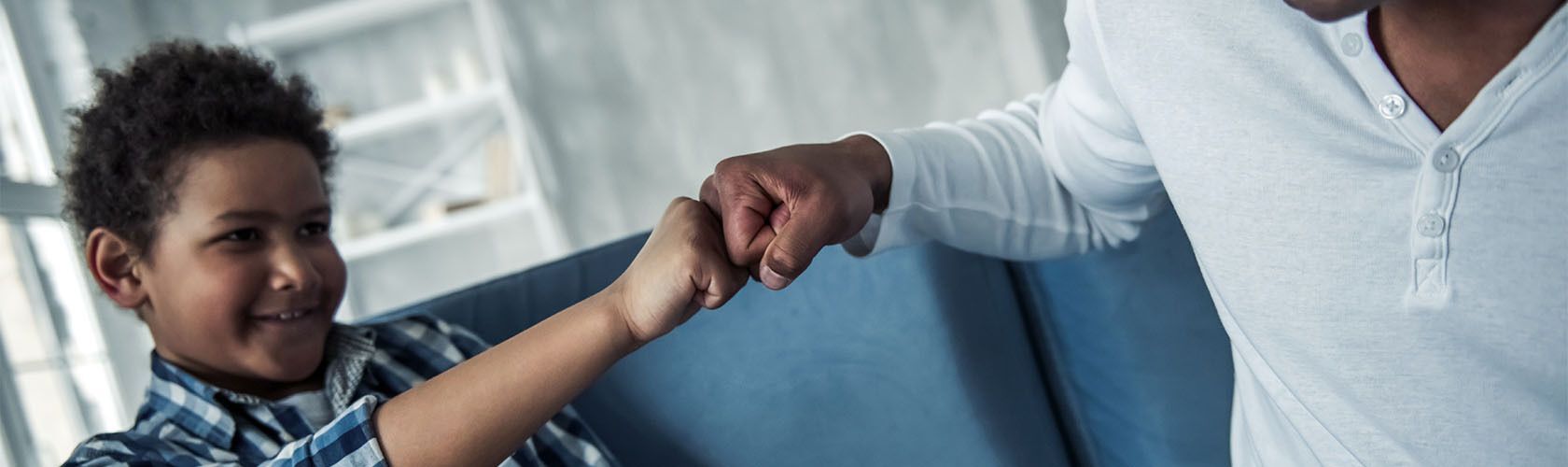 Caregivers sitting with two children